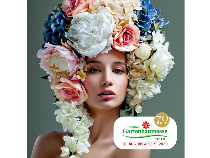 Výstava kvetov, žena s kvetmi na hlave - reklama na výstavu v meste Tulln